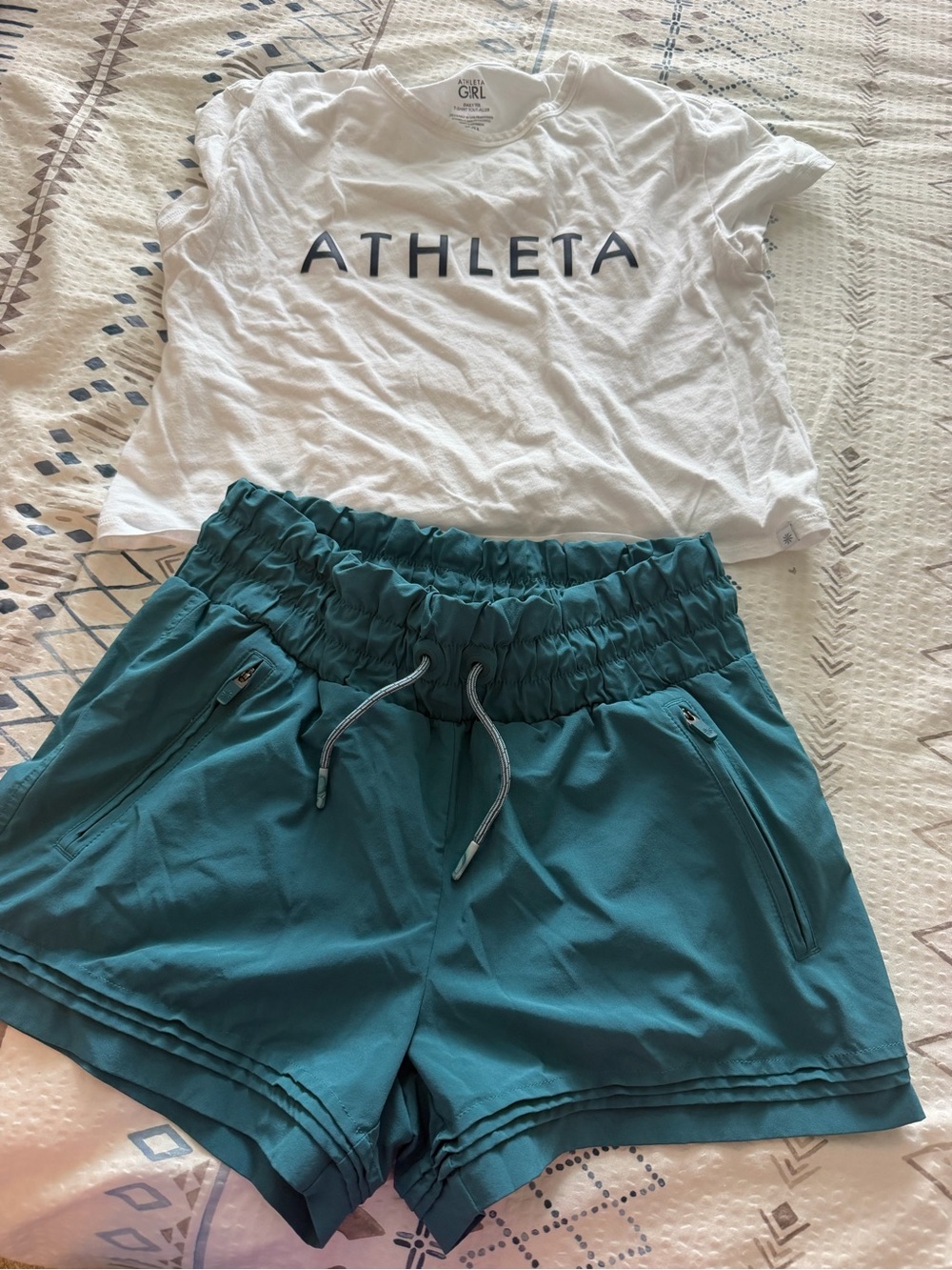 Athleta Teal Drawstring Athletic Shorts for Kids with cropped shirt.